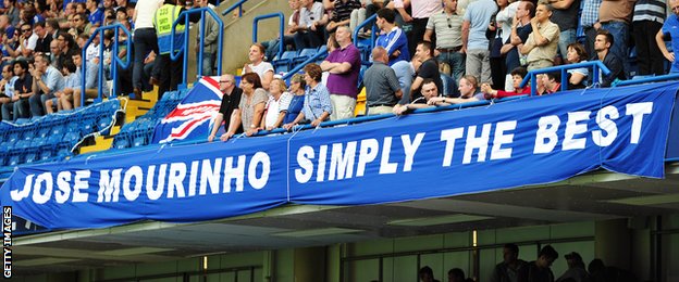 Chelsea fans stand behind a banner dedicated to Jose Mourinho at Stamford Bridge