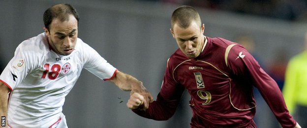 Kenny Miller (right) was in action for Scotland in 2007