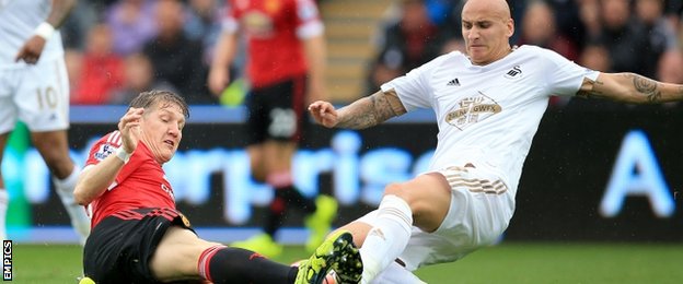 Jonjo Shelvey (right) tackles Manchester United's Bastian Schweinsteiger