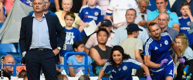 Jose Mourinho looks on as former club medic Eva Carneiro races to attend to injured Chelsea midfielder Eden Hazard